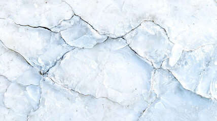 Fototapeta premium top view of cracked ice texture, showcasing intricate patterns and cool, frosty appearance. surface is marked by natural lines and fractures, creating unique and abstract design