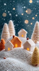 Knitted winter landscape with snowy hills and felt trees