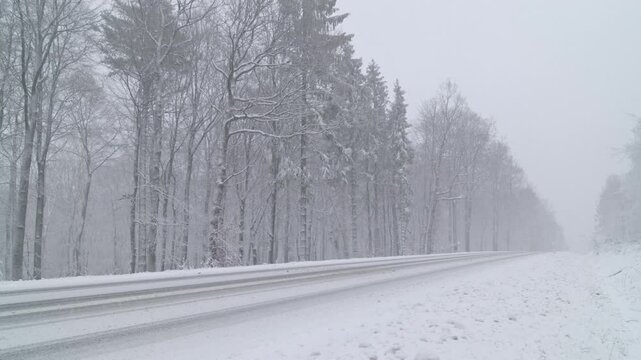 Snowy Winter Roads - Heavy snowfall on a mountain road - Static shot