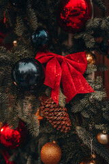 Christmas and New Year greenery outdoor festive decor, red bows, gold balls, pine cone and fresh pine branches, winter holiday details