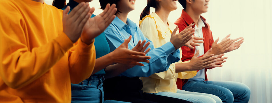 Group of startup company employee gather in line at corporate event to applaud achievement and celebrate company's success or business presentation meeting with audience in panorama banner. Synergic