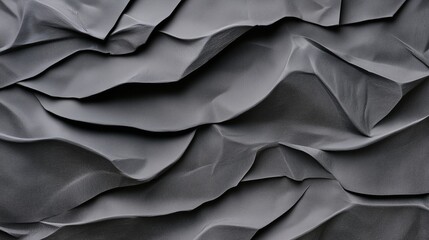 Obraz premium Black crumpled paper texture backdrop. Background of wrinkled black paper with deep folds.