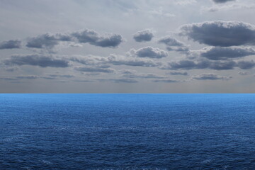 Obraz premium Light Gray Cumulus Cloud Over a Blue Sea
