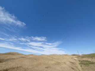 View of landcape with yellow mountains or hills. Clouds on the sky. Vivid natural scenery photo.