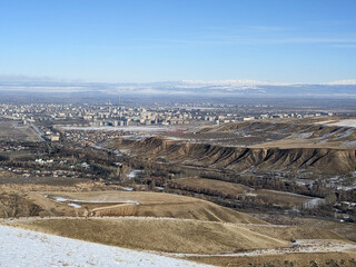 Winter view of mountain landcape. View of the city from the top of the hill. Vivid natural scenery...