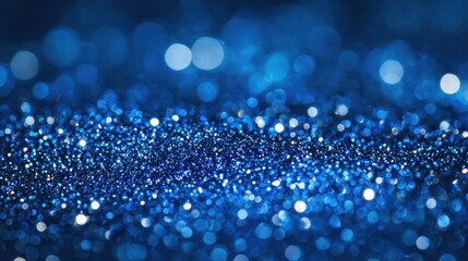 Bokeh effect with twinkling blue glitter aggregate.