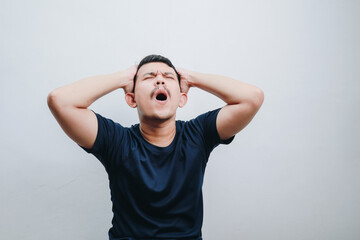 portrait of an asian man stressed and screaming. mental health concepts