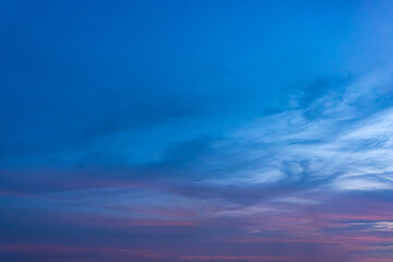 Dramatic cloudscape paints the blue canvas of the sky with sunlight's brushstrokes