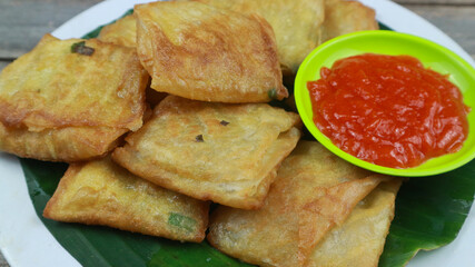 Martabak telur, Indonesian Food, savoury stuffed pancake filled with egg and meat on white plate