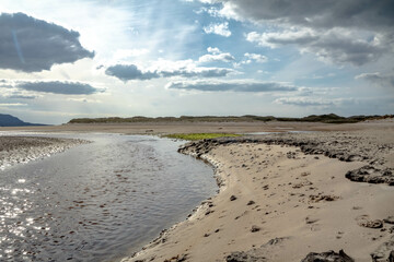 The stream that flows from Sheskinmore Nature Reserve to Ballinravey Strand between Ardara and Portnoo in Donegal - Ireland