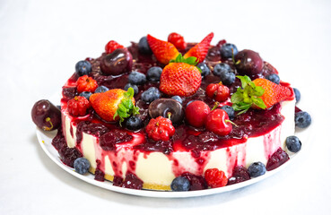 Traditional red fruit cheesecake with creative and luxurious decoration