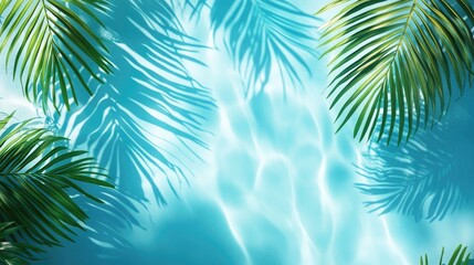 Obraz premium Tropical palm leaves creating intricate shadows on a shimmering blue pool surface, evoking a sense of summer relaxation and serene ambiance.