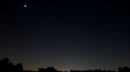 Fototapeta premium Night Sky Displaying Stars and a Crescent Moon
