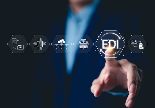 EDI, Electronic Data Interchange Concept. Businessman touching on EDI (Electronic Data Interchange) icons, global data transfer, digital security, information paperwork exchange in business context,