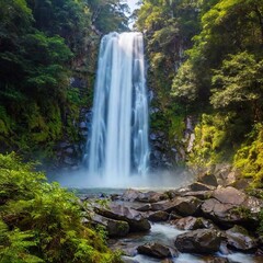 Fototapeta premium medium shot of a cascading waterfall surrounded by lush vegetation