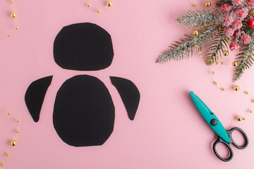 DIY. Step-by-step instructions for making a penguin out of paper. Flat lay, top view. Step 1