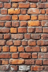 Obraz premium A close-up of a weathered vintage brick wall with visible mortar, ideal for backgrounds, overlays, or architectural-themed designs.