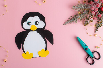 DIY. Step-by-step instructions for making a penguin out of paper. Flat lay, top view. Step 9
