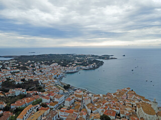 Aerial night city landscape of village and sea of Cadaques during summer Costa Brava