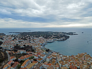 Aerial night city landscape of village and sea of Cadaques during summer Costa Brava