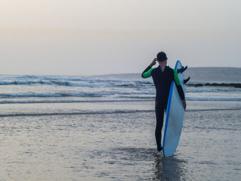  Surfer Facing the Waves, Heading into the Water, Morocco