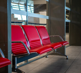 Row of Bold Red Seats at Lyon Airport