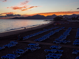 Sunset Beach Scene with Blue Loungers, Lanzarote, Canary Islands