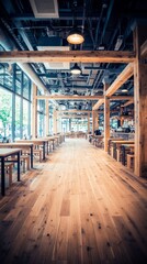 Fototapeta premium A spacious, modern interior of a restaurant with wooden elements and bright lighting.