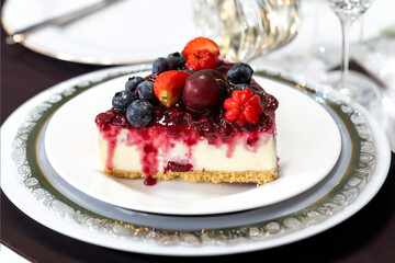 Traditional red fruit cheesecake with creative and luxurious decoration