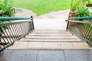 Old stone staircase at building office or home,Stairs, old Stairs near park and green grass,modern staircase,upper and under,retro or vintage style,space for text.