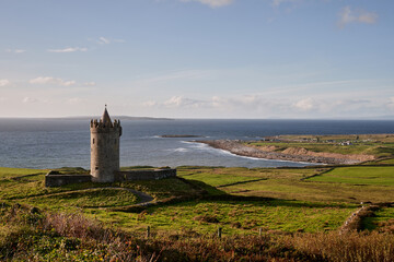 Dunguaire Castle overlooking the coastline near the Cliffs of Moher, Ireland