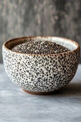 A bowl of chia seeds sitting on a table