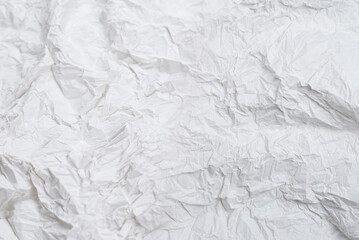 Obraz premium Crumpled white paper background.
