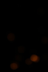 Red and fire orange bokeh on a black background, bokeh abstract background, modern abstract backdrop. Orange Christmas background, Xmas backdrop. Halloween scary concept, Halloween bokeh background
