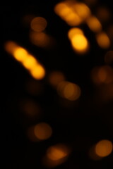 Red and fire orange bokeh on a black background, bokeh abstract background, modern abstract backdrop. Orange Christmas background, Xmas backdrop. Halloween scary concept, Halloween bokeh background
