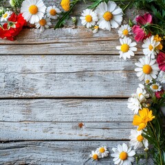 Obraz premium Colorful wildflowers frame a rustic wooden background, creating a cheerful and vibrant atmosphere.