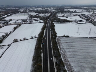 Obraz premium Snow-Covered Countryside Surrounding the A38 in Derbyshire, UK - 19th November 2024