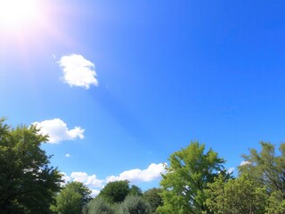 Obraz premium A vibrant and cheerful sunny background featuring bright blue skies, fluffy white clouds, and lush green trees, vibrant, green