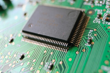 Close up of a microchip. Semiconductors or advanced technology concept background circuit board texture. Selected focus.