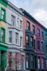 Obraz premium Touristic route on Notting Hill, walking on streets with colourful houses, Portobello road, city life, wealthy neighbourhoods in London, UK