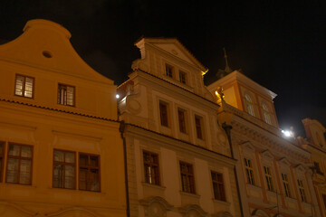 A captivating nighttime view showcases the historic architecture of the city, with illuminated...