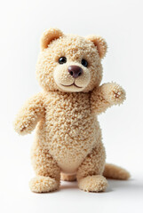 Obraz premium A soft and cuddly bear toy stands upright, waving with a friendly expression in a well-lit area, perfect for kids