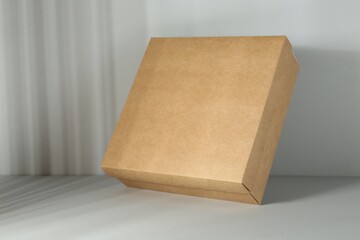 One blank cardboard box on white background. Mockup for design