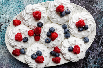 Meringues cakes with berries