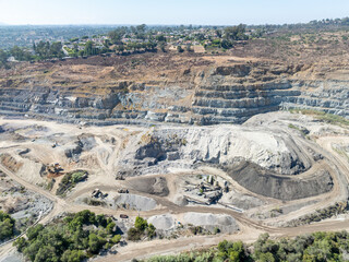 Aerial view of industrial sand and gravel quarry open-pit mining site In San Diego, California, USA