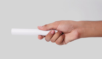 Closeup Photo Of A Male Hand Holding A New White PVC Plastic Pipe Isolated On White Background
