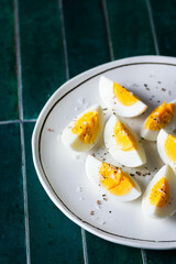 Hard-boiled eggs on plate