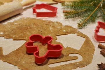 Making gingerbread for the holidays. Dough and molds for cutting out gingerbread.