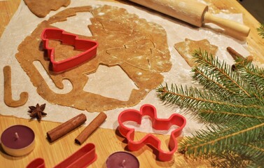 Making gingerbread for the holidays. Dough and molds for cutting out gingerbread.