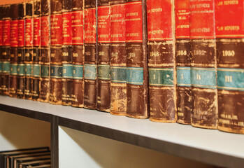 knowledge law books, in a bookshelf, legislation precedents for layers, attorneys and conveyers